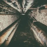 Photo Plumber fixing pipe